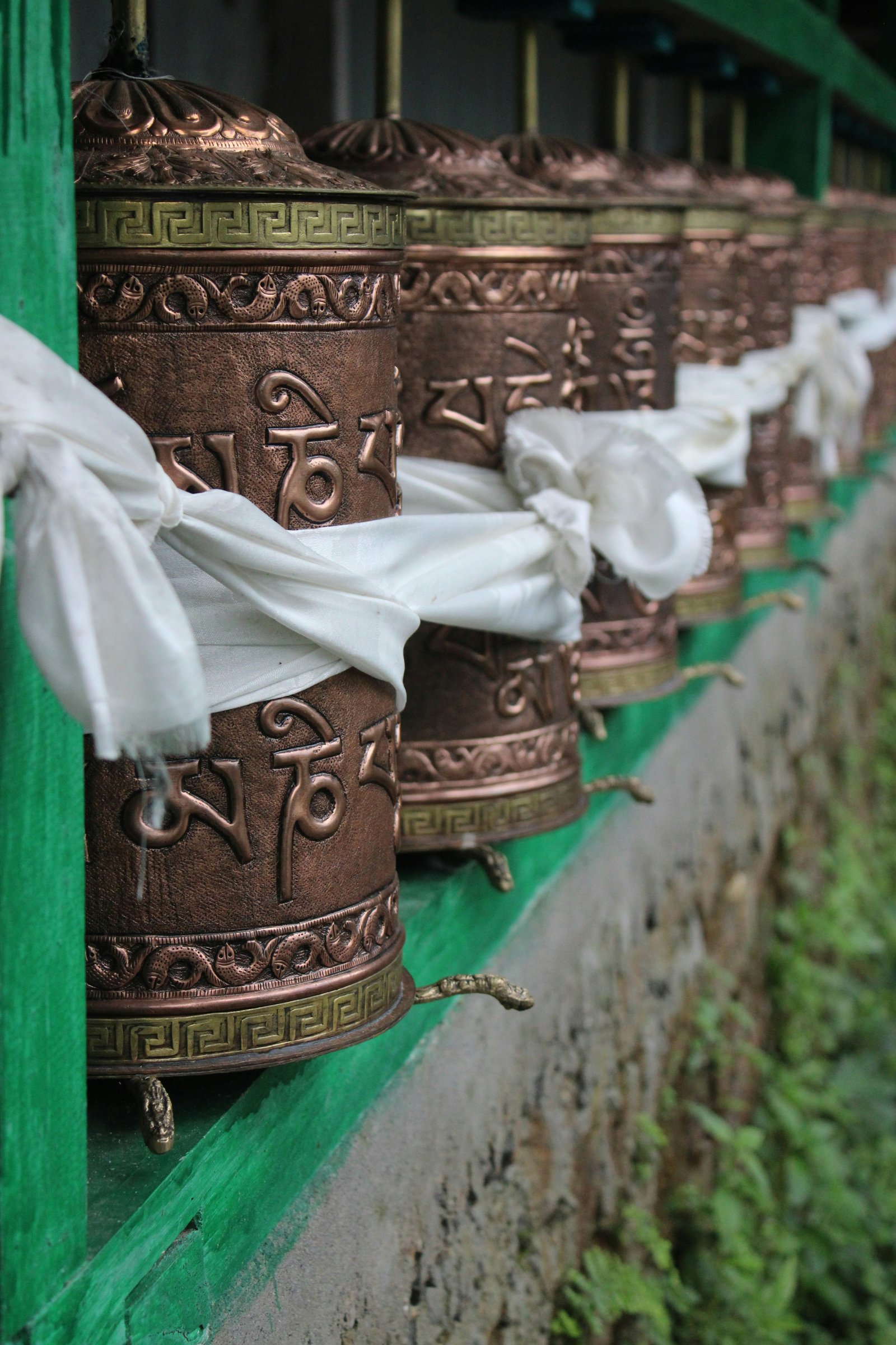 Tibetan prayer wheels encircling Boudhanath Stupa